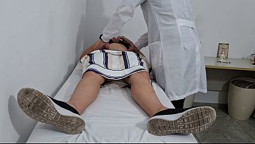 Medical examination of the patient’s abdomen in the doctor’s office.